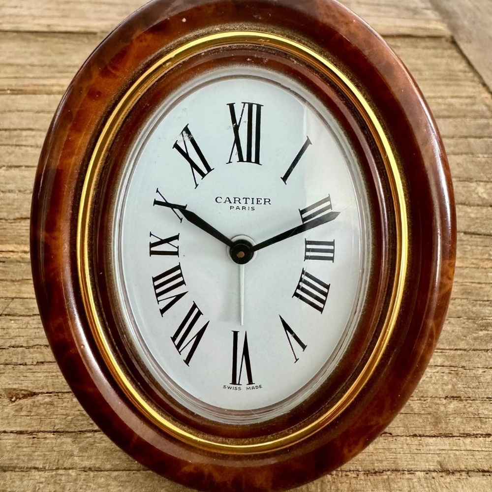 "Cartier, Travel Clock" and "Travel Frame".